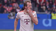 Bayern Munich striker Harry Kane holds his hand to his face during a match against Leverkusen on February 15, 2025.
