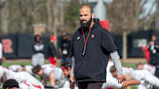 Defensive coordinator Joe Harasymiak observes warm up exercises before Rutgers University football spring practice at Marco Battaglia Practice Complex in Piscataway, NJ Tuesday April 11, 2023.

Ru02