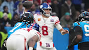 Nov 10, 2024; Munich, Germany; New York Giants quarterback Daniel Jones (8) throws the ball against the Carolina Panthers in the first half during the 2024 NFL Munich Game at Allianz Arena. Mandatory Credit: Kirby Lee-Imagn Images