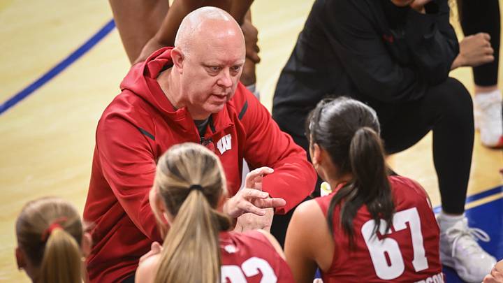 Wisconsin coach Kelly Sheffield talks to players during a timeout.