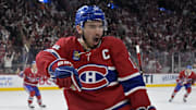 Apr 25, 2025; Montreal, Quebec, CAN; Montreal Canadiens forward Nick Suzuki (14) celebrates after scoring a goal against the Washington Capitals during the second period in game three of the first round of the 2025 Stanley Cup Playoffs at the Bell Centre. Mandatory Credit: Eric Bolte-Imagn Images