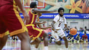 Nov 26, 2025; Lahaina, HI, USA; Arizona State Sun Devils guard Moe Odum (5) tries to get around the USC Trojans defense during the first half of the championship match at Lahaina Civic Center. Mandatory Credit: Marco Garcia-Imagn Images