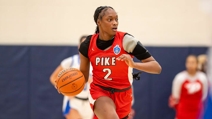 Pike High School junior Komari Booker (2) brings the ball up court during the first half of an IHSAA girls’ regional championship game against Franklin Central High School, Saturday, Feb. 15, 2025, at Decatur Central High School.