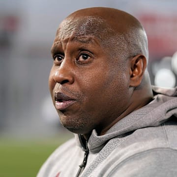 Carlos Locklyn talks with the media in 2025.
