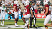 Aug 23, 2025; Honolulu, Hawaii, USA;  Stanford Cardinal running back Micah Ford (20) reacts after making a touch down over Hawaii Rainbow Warriors during the second half at Clarence T.C. Ching Athletics Complex. Mandatory Credit: Marco Garcia-Imagn Images