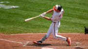 Jul 31, 2024; Baltimore, Maryland, USA; Baltimore Orioles second baseman Jackson Holliday (7) hits a home run against the Toronto Blue Jays during the fifth inning at Oriole Park at Camden Yards.