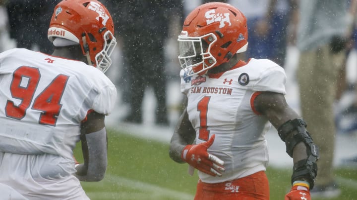 May 16, 2021; Frisco, Texas, USA; Sam Houston State Bearkats linebacker Trevor Williams (1) and defensive lineman Jevon Leon (94) react after a play during the second quarter against the South Dakota State Jackrabbits during the Division I FCS Championship football game at Toyota Stadium. Mandatory Credit: Tim Heitman-USA TODAY Sports