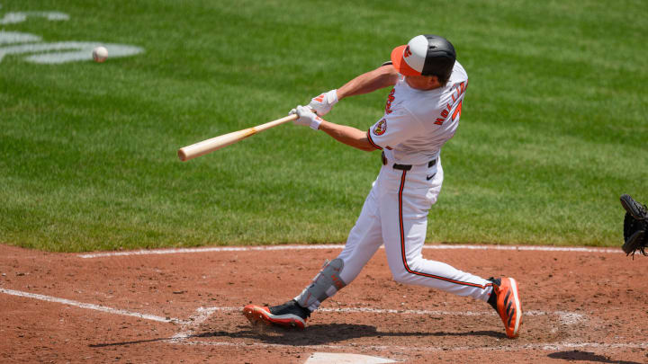 Jul 31, 2024; Baltimore, Maryland, USA; Baltimore Orioles second baseman Jackson Holliday (7) hits a home run against the Toronto Blue Jays during the fifth inning at Oriole Park at Camden Yards.