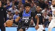 Dec 3, 2025; Orlando, Florida, USA; Orlando Magic guard Jase Richardson (11) drives to the hoop past San Antonio Spurs forward Julian Champagnie (30) in the fourth quarter at Kia Center. Mandatory Credit: Nathan Ray Seebeck-Imagn Images