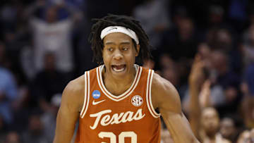 Mar 19, 2025; Dayton, OH, USA; Texas Longhorns guard Tre Johnson (20) high fives Xavier Musketeers head coach Sean Miller after making a three point basket in the second half at UD Arena. Mandatory Credit: Rick Osentoski-Imagn Images