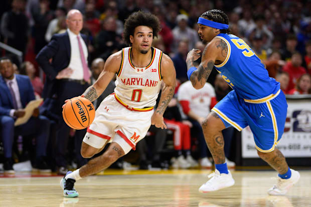 Maryland Terrapins guard Ja'Kobi Gillespie (0) drives to the basket as UCLA Bruins guard Skyy Clark (55) defends.