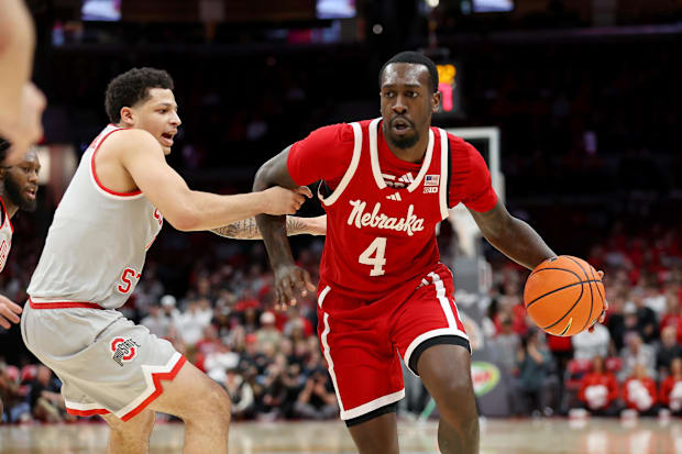 Nebraska Cornhuskers forward Juwan Gary (4) dribbles the ball as Ohio State Buckeyes guard John Mobley Jr. (0) defends.