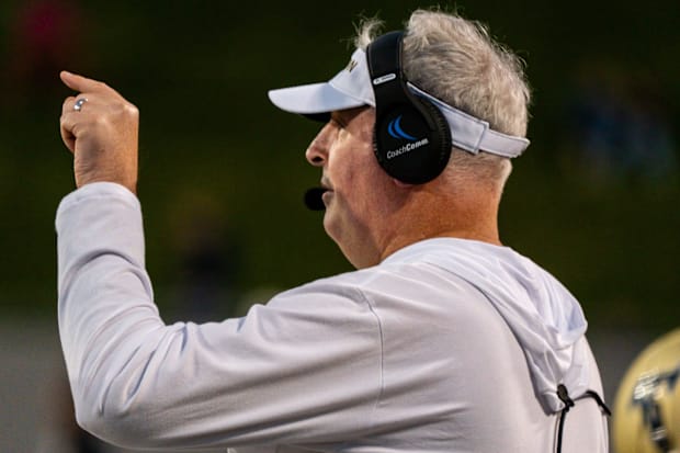 Akron Zips head coach Joe Moorhead counts the players on field during a game against Wyoming, Aug. 28, 2025, at InfoCision St