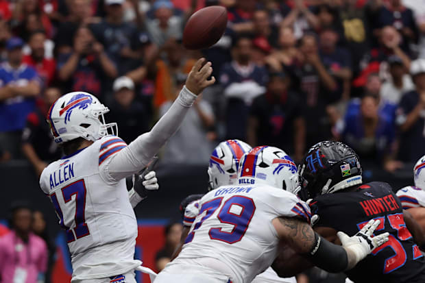 Buffalo Bills quarterback, Josh Allen attempts a pass against the Houston Texans.