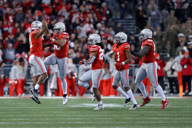 Players celebrate on defense.