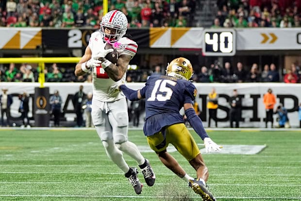 Ohio State Buckeyes wide receiver Emeka Egbuka makes a catch against Notre Dame Fighting Irish cornerback Leonard Moore