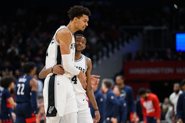 San Antonio Spurs center Victor Wembanyama (1) and guard De'Aaron Fox (4)