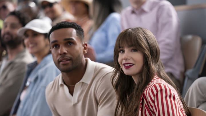 Emily in Paris. (L to R) Lucien Laviscount as Alfie, Lily Collins as Emily in Emily in Paris. Cr. Stephanie Branchu/Netflix