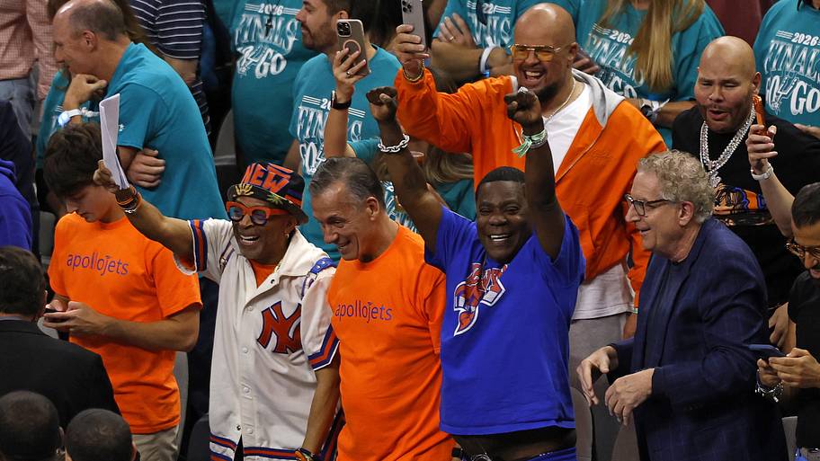 Actor Tracy Morgan reacts with Spike Lee after the New York Knicks defeated the San Antonio Spurs.