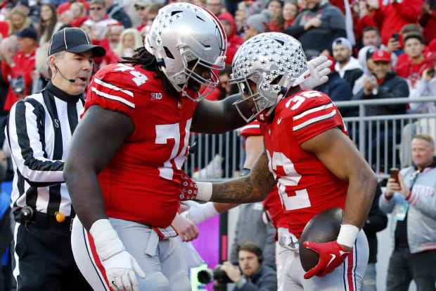 Lineman celebrates TD with running back.