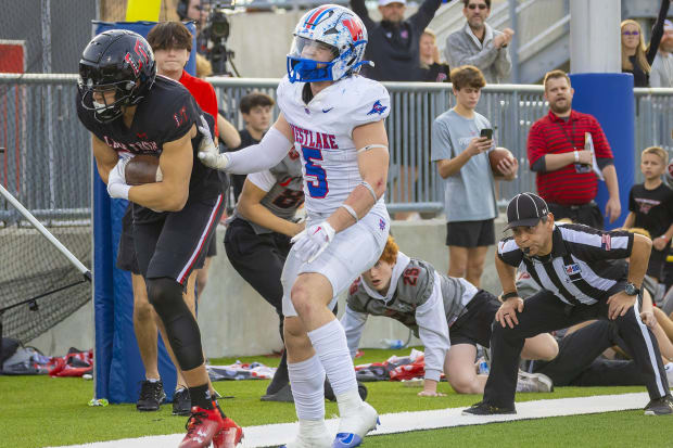 Lake Travis tight end Josiah Thomas secures a pass against Austin Westlake on Dec. 2, 2023 in the Texas state quarterfinals.