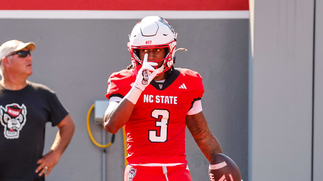 Oct 4, 2025; Raleigh, North Carolina, USA;  NC State Wolfpack running back Hollywood Smothers (3) celebrates a touchdown during the first half of the game against Campbell Fighting Camels at Carter-Finley Stadium. Mandatory Credit: Jaylynn Nash-Imagn Images