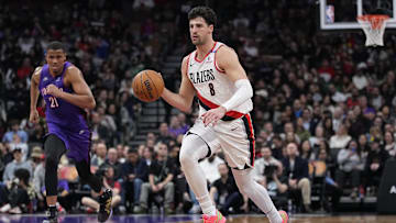 Apr 3, 2025; Toronto, Ontario, CAN; Portland Trail Blazers forward Deni Avdija (8) dribbles up court as Toronto Raptors center Orlando Robinson (21) defends during the second half at Scotiabank Arena. Mandatory Credit: John E. Sokolowski-Imagn Images