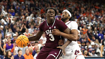 Jan 14, 2025; Auburn, Alabama, USA;  Mississippi State Bulldogs forward KeShawn Murphy (3) is pressured by Auburn Tigers forward Chaney Johnson (31) during the first half at Neville Arena. Mandatory Credit: John Reed-Imagn Images