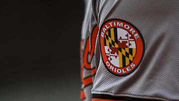 May 5, 2024; Cincinnati, Ohio, USA; The Baltimore Orioles logo on the sleeve of designated hitter Gunnar Henderson (2) as he prepares on deck during the seventh inning against the Cincinnati Reds at Great American Ball Park. Mandatory Credit: Katie Stratman-Imagn Images