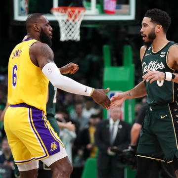 Jan 28, 2023; Boston, Massachusetts, USA; Boston Celtics forward Jayson Tatum (0) and Los Angeles Lakers forward LeBron James (6) react before playing at TD Garden. Mandatory Credit: Paul Rutherford-USA TODAY Sports