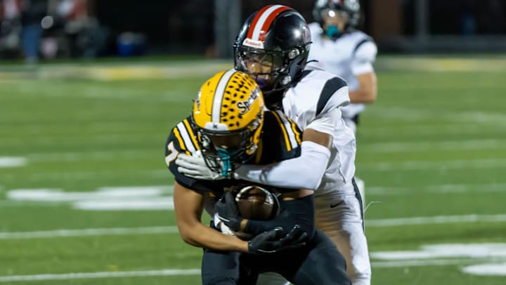 Aliquippa defensive back Raymond Miller (22) wraps up Montour wide receiver James Bundridge (7) during Aliquippa's Parkway Conference game against Montour on Oct. 18 at Thomas J. Birko Memorial Stadium. Aliquippa defensive back Raymond Miller (22) wraps up Montour wide receiver James Bundridge (7) during Aliquippa's Parkway Conference game against Montour on Oct. 18 at Thomas J. Birko Memorial Stadium.