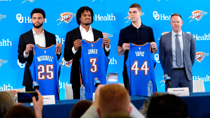 From left, Ajay Mitchell, Dillon Jones and Nikola Topic stand with Thunder general manager Sam Presti during an introductory press conference for the 2024 Thunder draft picks at Oklahoma Contemporary Arts Center in Oklahoma City, Saturday, June, 29, 2024.