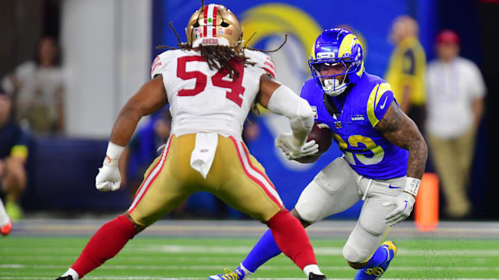 Oct 2, 2025; Inglewood, California, USA; Los Angeles Rams running back Kyren Williams (23) rushes the ball past San Francisco 49ers middle linebacker Fred Warner (54) during the second half at SoFi Stadium. Mandatory Credit: Gary A. Vasquez-Imagn Images Oct 2, 2025; Inglewood, California, USA; Los Angeles Rams running back Kyren Williams (23) rushes the ball past San Francisco 49ers middle linebacker Fred Warner (54) during the second half at SoFi Stadium. Mandatory Credit: Gary A. Vasquez-Imagn Images