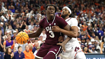 Jan 14, 2025; Auburn, Alabama, USA;  Mississippi State Bulldogs forward KeShawn Murphy (3) is pressured by Auburn Tigers forward Chaney Johnson (31) during the first half at Neville Arena. Mandatory Credit: John Reed-Imagn Images