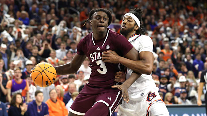 Jan 14, 2025; Auburn, Alabama, USA;  Mississippi State Bulldogs forward KeShawn Murphy (3) is pressured by Auburn Tigers forward Chaney Johnson (31) during the first half at Neville Arena. Mandatory Credit: John Reed-Imagn Images