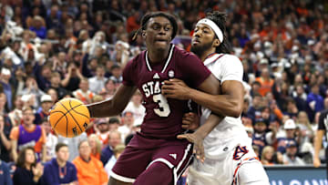 Jan 14, 2025; Auburn, Alabama, USA;  Mississippi State Bulldogs forward KeShawn Murphy (3) is pressured by Auburn Tigers forward Chaney Johnson (31) during the first half at Neville Arena. Mandatory Credit: John Reed-Imagn Images