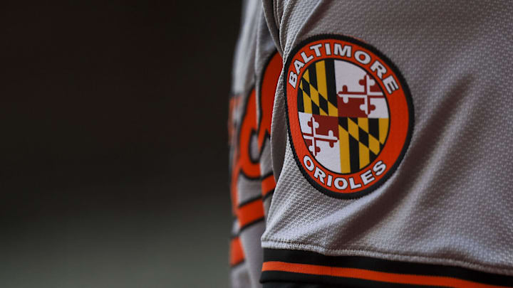 May 5, 2024; Cincinnati, Ohio, USA; The Baltimore Orioles logo on the sleeve of designated hitter Gunnar Henderson (2) as he prepares on deck during the seventh inning against the Cincinnati Reds at Great American Ball Park. 