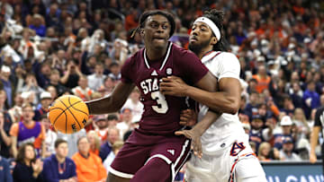 Jan 14, 2025; Auburn, Alabama, USA;  Mississippi State Bulldogs forward KeShawn Murphy (3) is pressured by Auburn Tigers forward Chaney Johnson (31) during the first half at Neville Arena. Mandatory Credit: John Reed-Imagn Images