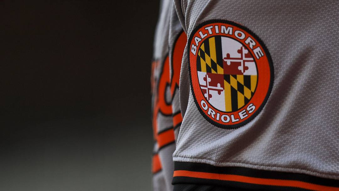 May 5, 2024; Cincinnati, Ohio, USA; The Baltimore Orioles logo on the sleeve of designated hitter Gunnar Henderson (2) as he prepares on deck during the seventh inning against the Cincinnati Reds at Great American Ball Park. 
