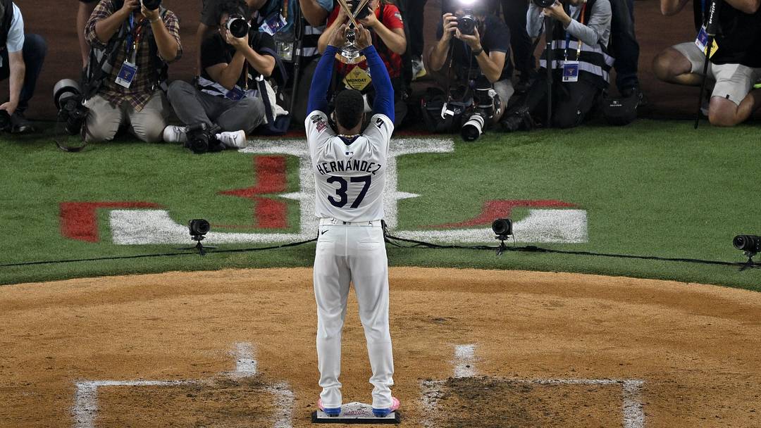 Jul 15, 2024; Arlington, TX, USA; National League outfielder Teoscar Hernandez of the Los Angeles Dodgers (37) poses with the trophy after he wins the 2024 All Star Game Home Run Derby at Globe Life Field. Mandatory Credit: Jerome Miron-USA TODAY Sports
