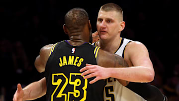Feb 8, 2024; Los Angeles, California, USA; Denver Nuggets center Nikola Jokic (15) hugs Los Angeles Lakers forward LeBron James (23) after the Nuggets defeated the Lakers at Crypto.com Arena. Mandatory Credit: Jason Parkhurst-Imagn Images