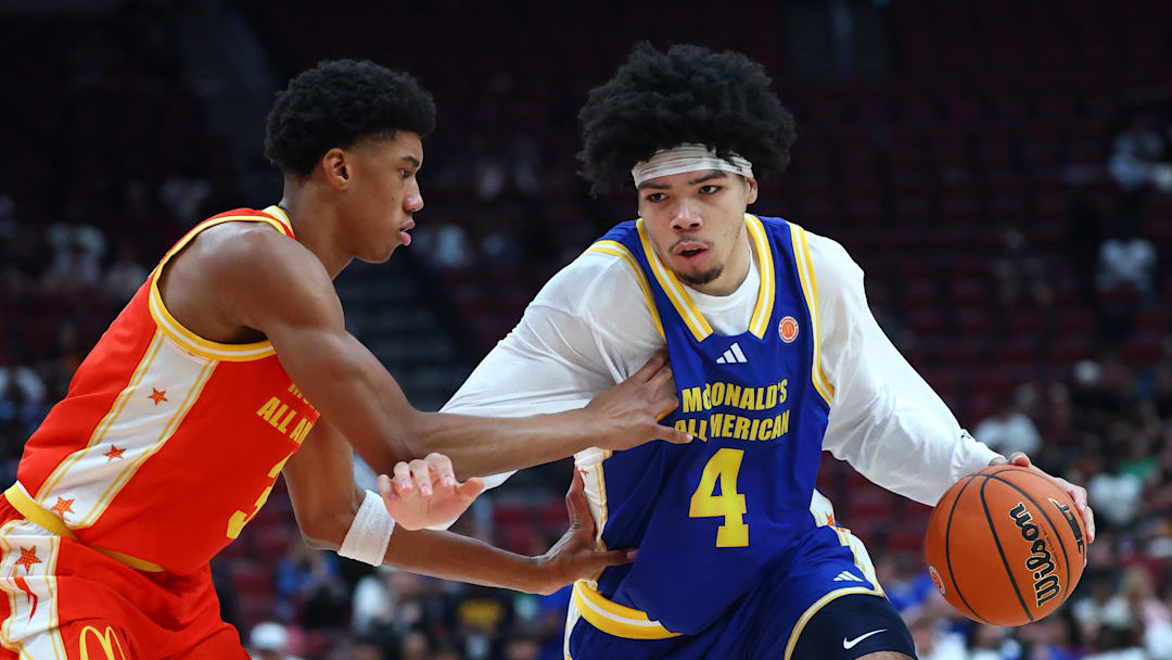 Mar 31, 2026; Glendale, AZ, USA; Tyran Stokes (4) moves the ball against Bruce Branch III (3) during the McDonalds All American Boys Game at Desert Diamond Arena. Mandatory Credit: Mark J. Rebilas-Imagn Images