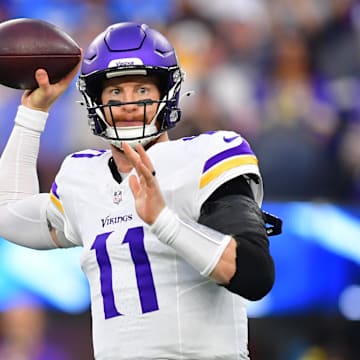 Oct 23, 2025; Inglewood, California, USA; Minnesota Vikings quarterback Carson Wentz (11) drops back to pass against the Los Angeles Chargers during the first half at SoFi Stadium.