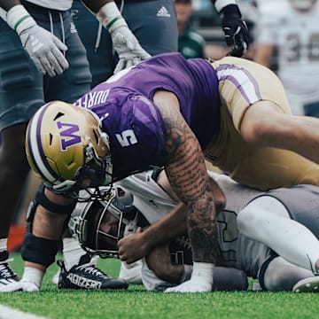 Zach Durfee smothers Eastern Michigan quarterback Cole Snyder on a sack. 