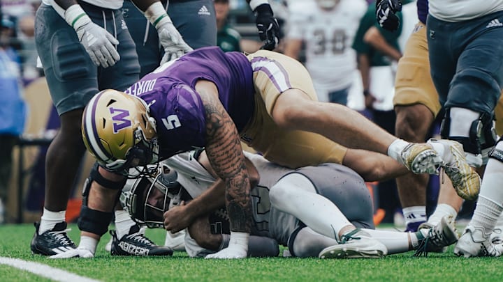 Zach Durfee smothers Eastern Michigan quarterback Cole Snyder on a sack. 