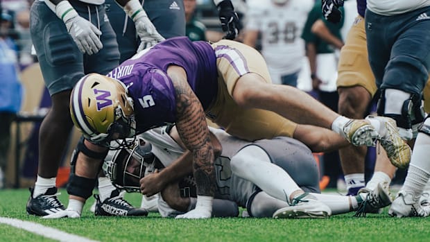 Zach Durfee smothers Eastern Michigan quarterback Cole Snyder on a sack. 