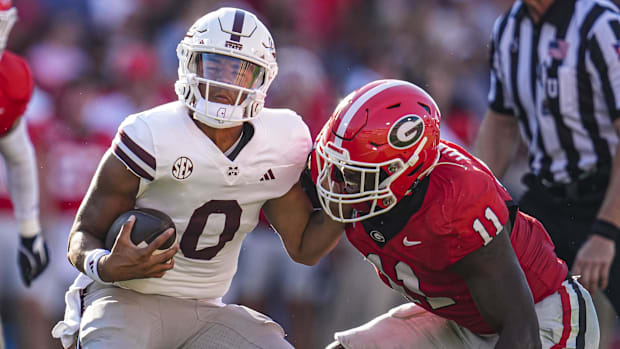 Mississippi State Bulldogs quarterback Michael Van Buren Jr. (0) is tackled by Georgia Bulldogs linebacker Jalon Walker