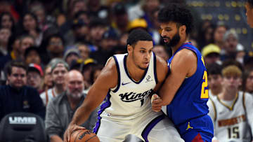 Nov 22, 2025; Denver, Colorado, USA; Sacramento Kings forward Keegan Murray (13) handles the ball against Denver Nuggets guard Jamal Murray (27) during the first half at Ball Arena. Mandatory Credit: Christopher Hanewinckel-Imagn Images