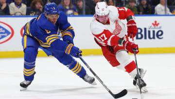 Dec 5, 2023; Buffalo, New York, USA;  Buffalo Sabres defenseman Erik Johnson (6) tries to defend as Detroit Red Wings right wing Daniel Sprong (17) skates with the puck during the first period at KeyBank Center. Mandatory Credit: Timothy T. Ludwig-USA TODAY Sports