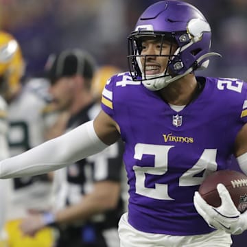 Dec 29, 2024; Minneapolis, Minnesota, USA; Minnesota Vikings safety Camryn Bynum (24) celebrates recovering a fumble by Green Bay Packers running back Josh Jacobs (8) in the first quarter at U.S. Bank Stadium. Mandatory Credit: Dan Powers/USA TODAY NETWORK-Wisconsin via Imagn Images